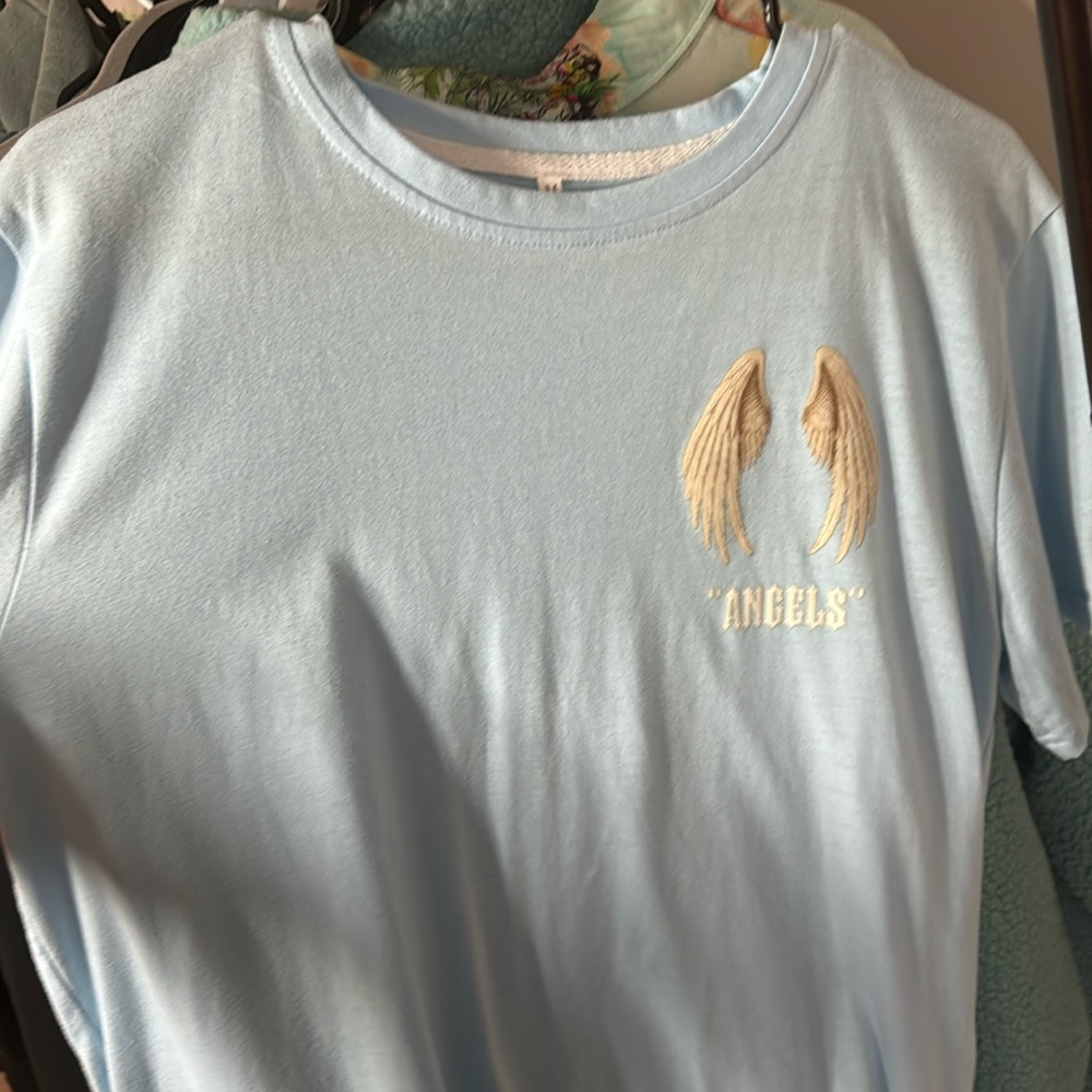 Blue shirt with angel wings